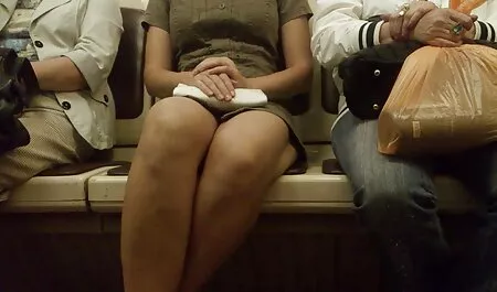 A girl chinese ladyboy wearing a gray sweater sitting with pus, naked, on boyfred